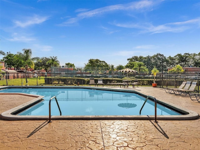 1489 Fairway Rd, Pembroke Pines, FL 33026 - community pool with a patio