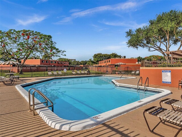 1489 Fairway Rd, Pembroke Pines, FL 33026 - community pool featuring a patio