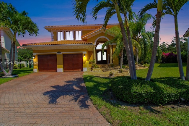 7753 SW 193rd St, Cutler Bay, FL 33157 - mediterranean / spanish home with a tile roof, decorative driveway, a garage, and stucco siding