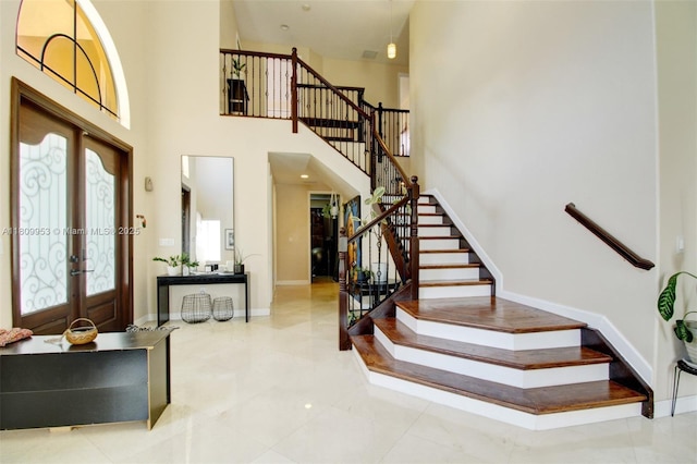 7753 SW 193rd St, Cutler Bay, FL 33157 - foyer featuring stairs, french doors, baseboards, and a towering ceiling