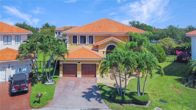7753 SW 193rd St, Cutler Bay, FL 33157 - mediterranean / spanish-style house with a tile roof, decorative driveway, a front yard, and stucco siding