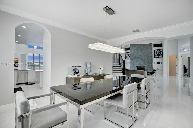 10457 Laurel Rd, Davie, FL 33328 - dining area with arched walkways, crown molding, stairway, recessed lighting, and light tile patterned flooring