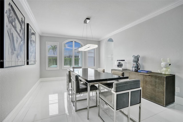10457 Laurel Rd, Davie, FL 33328 - dining room featuring crown molding, arched walkways, baseboards, and light tile patterned floors