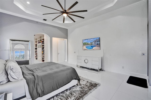 10457 Laurel Rd, Davie, FL 33328 - bedroom with a raised ceiling, arched walkways, tile patterned flooring, baseboards, and ceiling fan