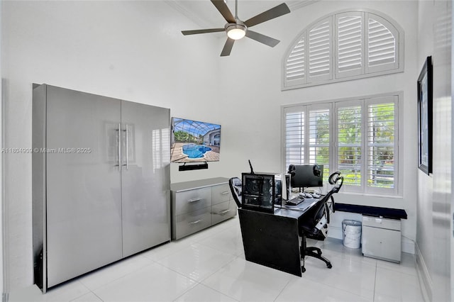 10457 Laurel Rd, Davie, FL 33328 - home office featuring a towering ceiling, ceiling fan, and light tile patterned flooring