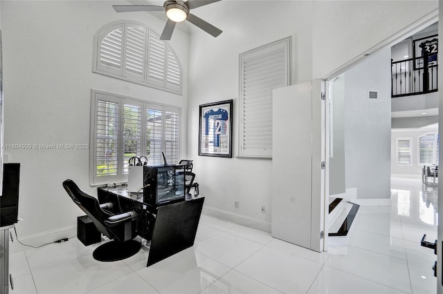 10457 Laurel Rd, Davie, FL 33328 - tiled home office featuring baseboards, ceiling fan, and a high ceiling