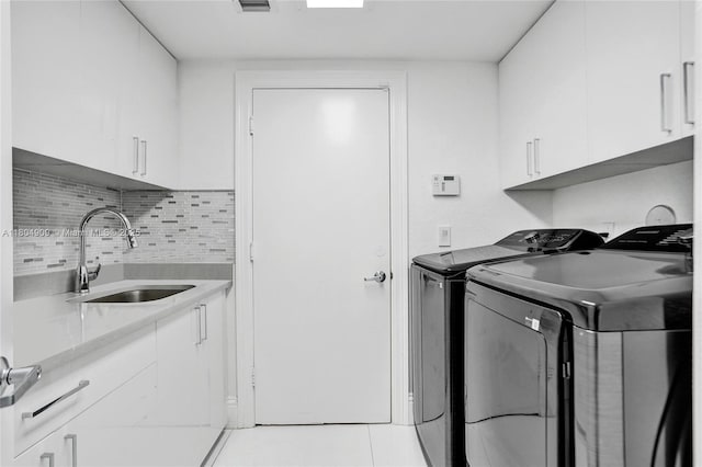 10457 Laurel Rd, Davie, FL 33328 - laundry area featuring cabinet space and independent washer and dryer