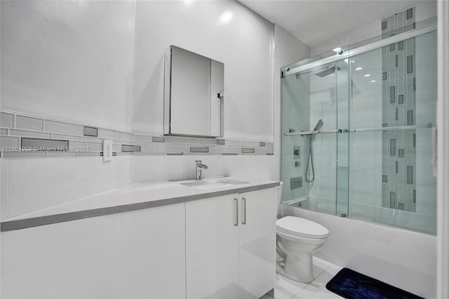10457 Laurel Rd, Davie, FL 33328 - bathroom featuring toilet, bath / shower combo with glass door, vanity, backsplash, and tile patterned floors
