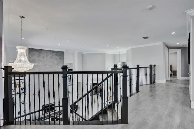 10457 Laurel Rd, Davie, FL 33328 - corridor featuring a chandelier, an upstairs landing, recessed lighting, wood finished floors, and ornamental molding