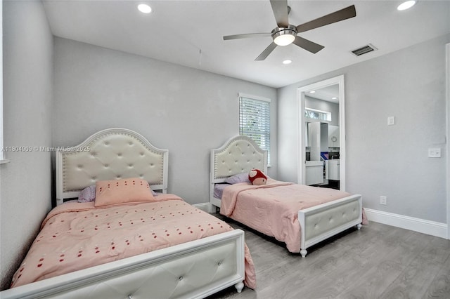 10457 Laurel Rd, Davie, FL 33328 - bedroom with wood finished floors, recessed lighting, baseboards, a ceiling fan, and ensuite bathroom