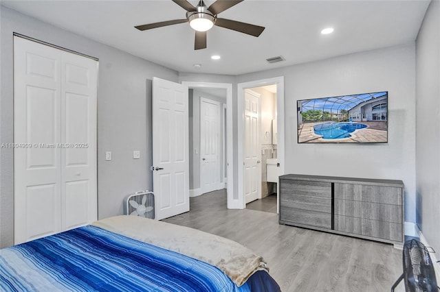 10457 Laurel Rd, Davie, FL 33328 - bedroom featuring wood finished floors, recessed lighting, a ceiling fan, baseboards, and ensuite bathroom