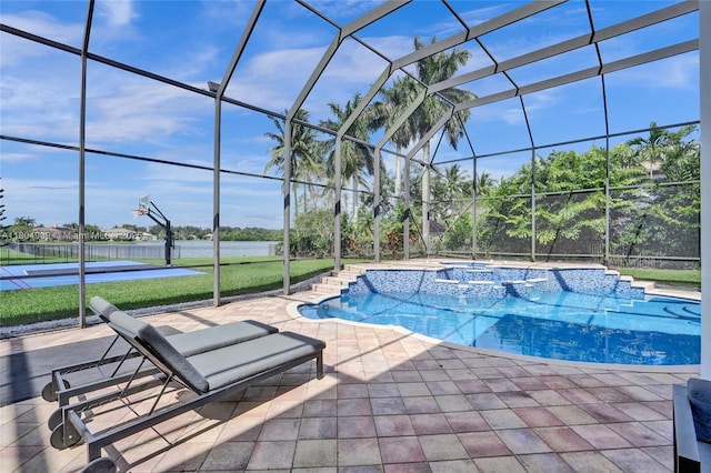 10457 Laurel Rd, Davie, FL 33328 - view of pool featuring a water view, a lawn, a pool with connected hot tub, a lanai, and a patio