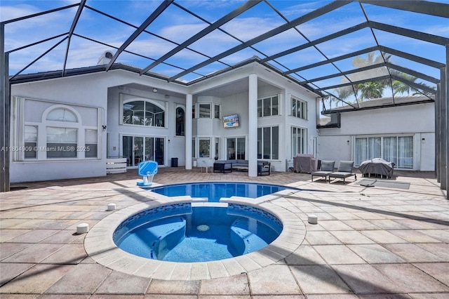 10457 Laurel Rd, Davie, FL 33328 - back of house featuring a patio, a pool with connected hot tub, stucco siding, outdoor lounge area, and a lanai
