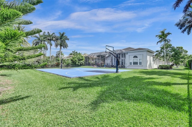 10457 Laurel Rd, Davie, FL 33328 - view of basketball court featuring basketball hoop and a lawn