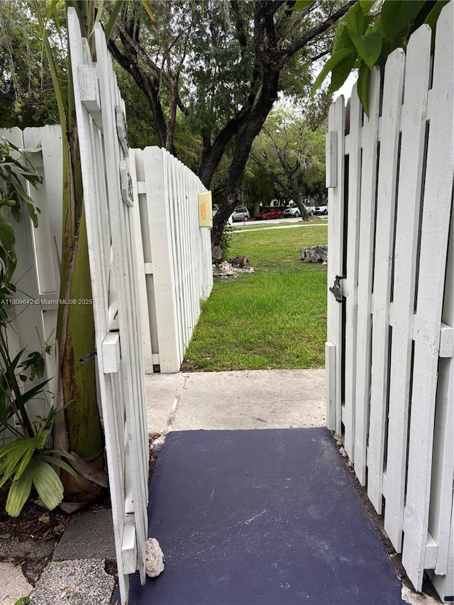15428 SW 85th Ln Unit 159, Miami, FL 33193 - view of grassy yard featuring a gate