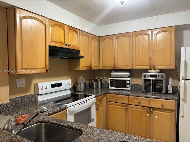 15428 SW 85th Ln Unit 159, Miami, FL 33193 - kitchen featuring white appliances, under cabinet range hood, dark stone counters, and brown cabinets