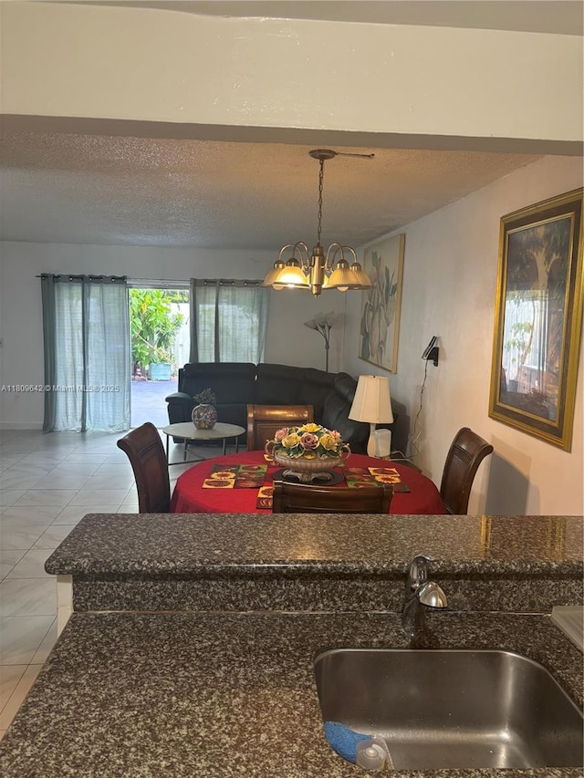 15428 SW 85th Ln Unit 159, Miami, FL 33193 - living room with a chandelier, a textured ceiling, and light tile patterned floors