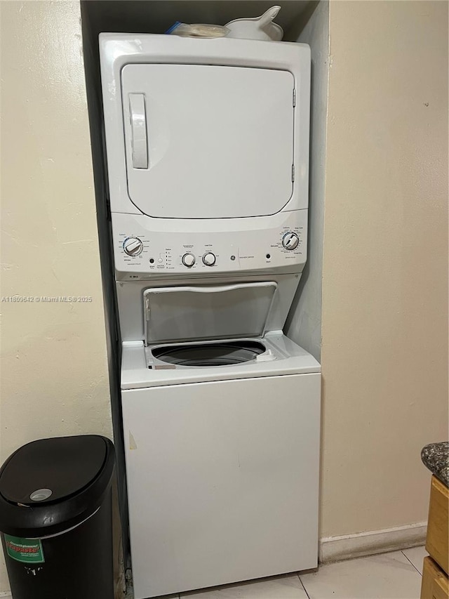 15428 SW 85th Ln Unit 159, Miami, FL 33193 - laundry room with stacked washer / dryer and light tile patterned floors