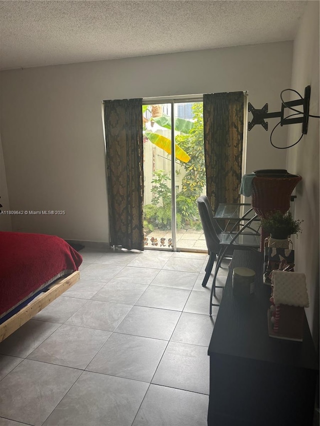 15428 SW 85th Ln Unit 159, Miami, FL 33193 - bedroom with access to exterior and a textured ceiling