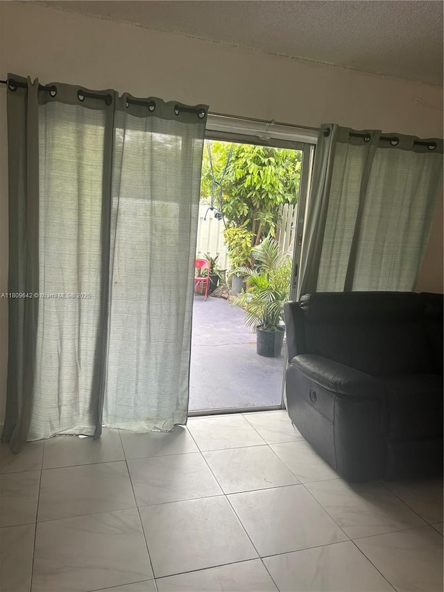 15428 SW 85th Ln Unit 159, Miami, FL 33193 - entryway with light tile patterned floors and a textured ceiling