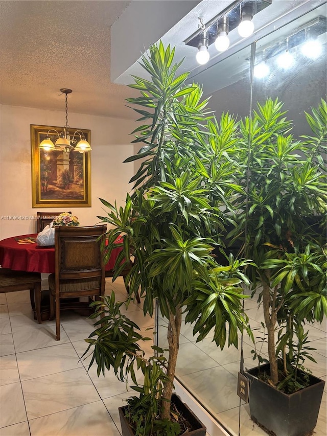 15428 SW 85th Ln Unit 159, Miami, FL 33193 - corridor featuring a chandelier, a textured ceiling, and light tile patterned flooring