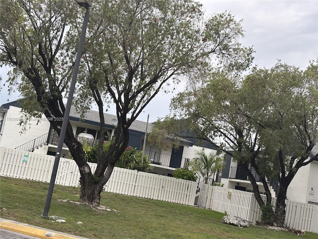 15428 SW 85th Ln Unit 159, Miami, FL 33193 - view of front facade featuring a fenced front yard and a gate