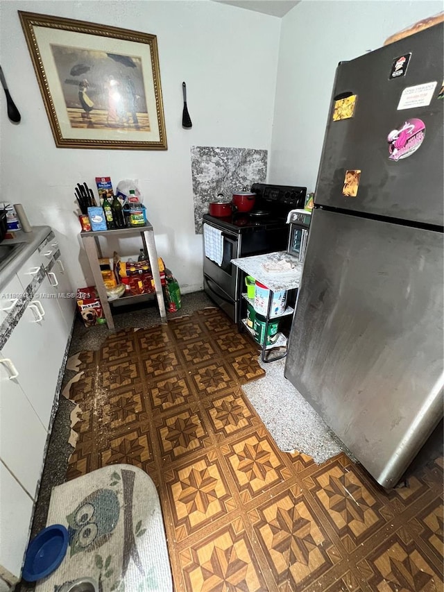 7821 NW 30th St, Davie, FL 33024 - kitchen featuring freestanding refrigerator and electric range oven