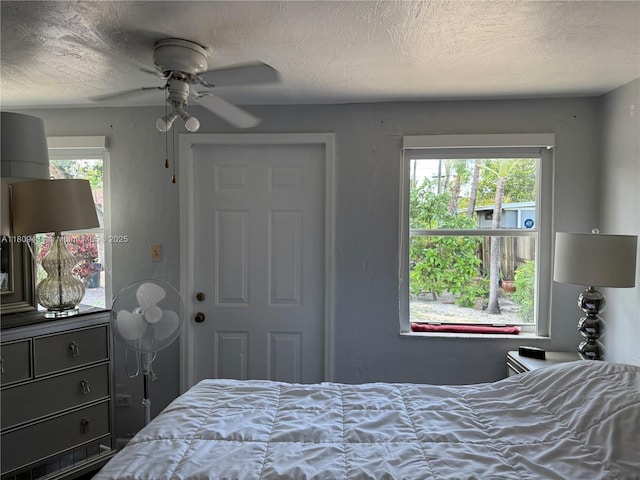 7951 NW 30th St, Davie, FL 33024 - bedroom with a textured ceiling and a ceiling fan