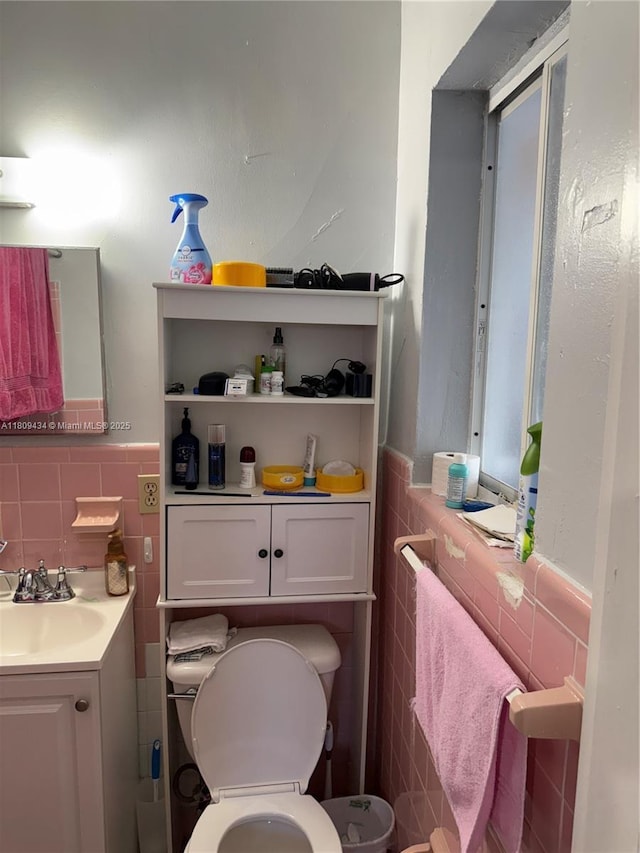 7951 NW 30th St, Davie, FL 33024 - half bathroom featuring tile walls, wainscoting, toilet, and vanity