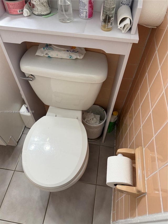 7951 NW 30th St, Davie, FL 33024 - half bathroom featuring tile patterned flooring, toilet, and tile walls