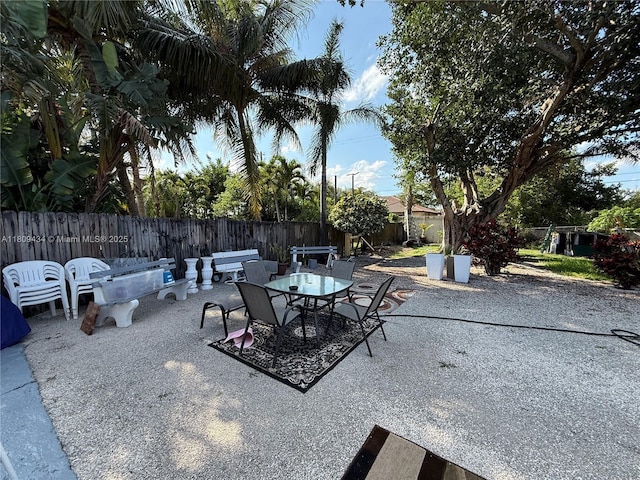 7951 NW 30th St, Davie, FL 33024 - fenced backyard featuring a patio area and outdoor dining space
