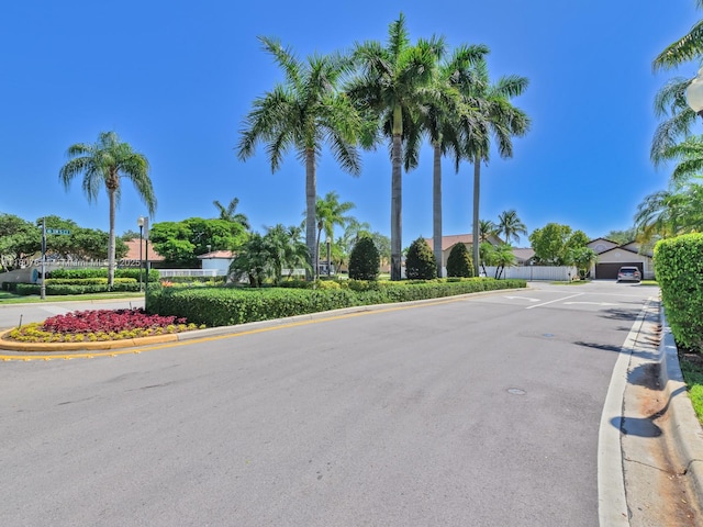 17654 SW 5th Ct, Pembroke Pines, FL 33029 - view of asphalt road featuring curbs and street lights