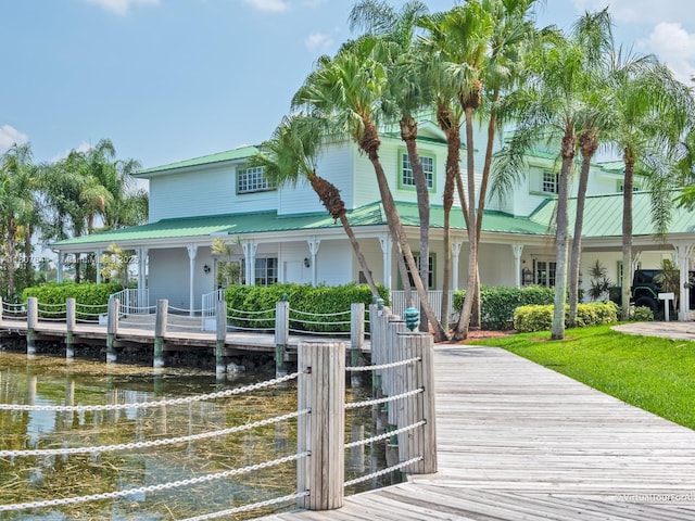 17654 SW 5th Ct, Pembroke Pines, FL 33029 - view of front facade with a water view, a porch, and metal roof