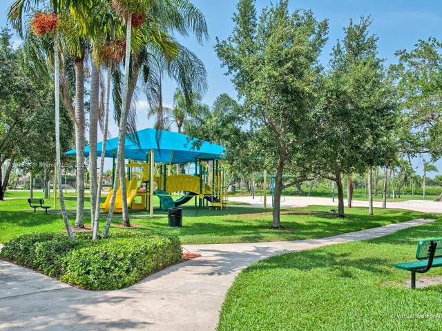 17654 SW 5th Ct, Pembroke Pines, FL 33029 - view of home's community featuring a lawn