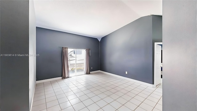 14723 SW 155th Pl, Miami, FL 33196 - tiled spare room featuring vaulted ceiling and baseboards