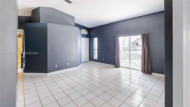 14723 SW 155th Pl, Miami, FL 33196 - unfurnished room featuring tile patterned flooring, baseboards, and vaulted ceiling