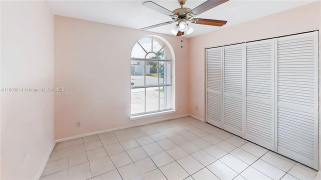 14723 SW 155th Pl, Miami, FL 33196 - empty room with a ceiling fan, light tile patterned flooring, and baseboards