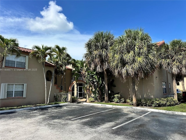 301 SW 86th Ave Unit 208, Pembroke Pines, FL 33025 - view of property featuring uncovered parking