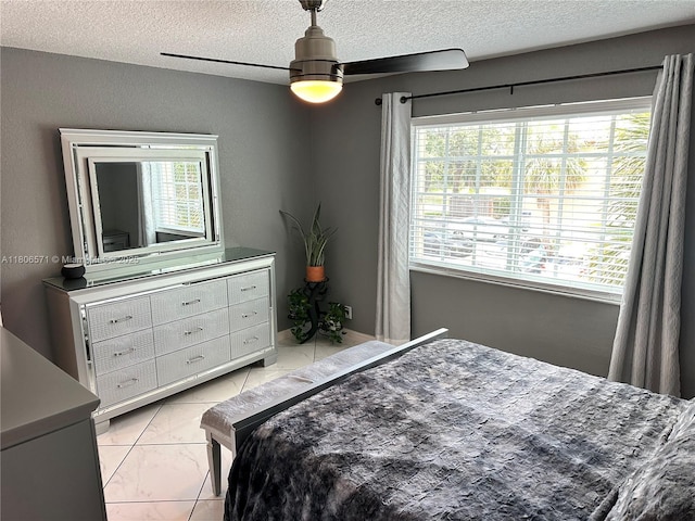 301 SW 86th Ave Unit 208, Pembroke Pines, FL 33025 - bedroom featuring a textured ceiling, light marble finish floors, and ceiling fan
