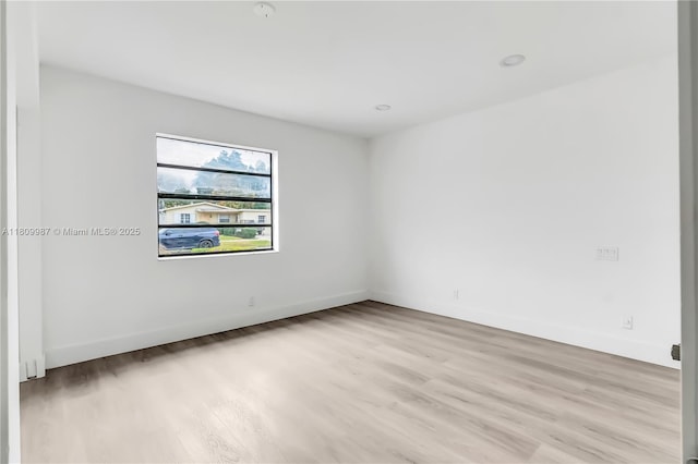 235 SW 3rd Ct, Deerfield Beach, FL 33441 - unfurnished room featuring light wood-type flooring and baseboards