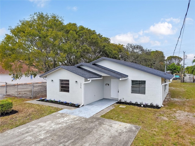 235 SW 3rd Ct, Deerfield Beach, FL 33441 - view of front of house with stucco siding and roof with shingles