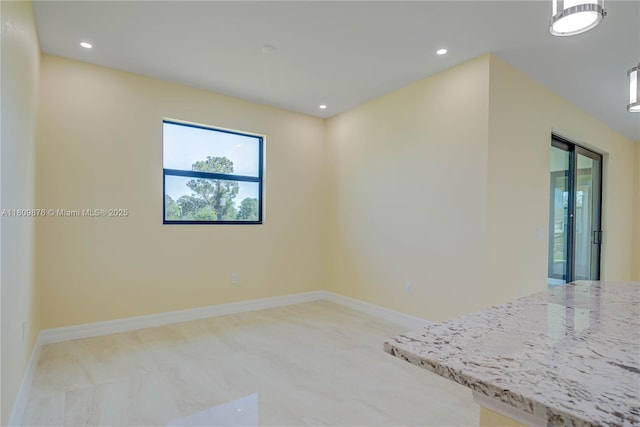 637 Cardinal St E, Lehigh Acres, FL 33974 - spare room with recessed lighting and baseboards