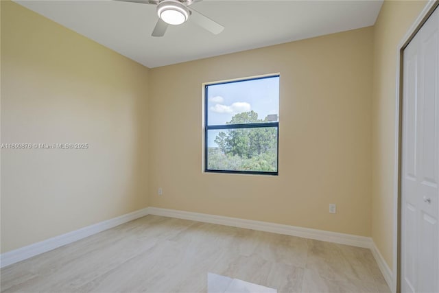 637 Cardinal St E, Lehigh Acres, FL 33974 - spare room featuring a ceiling fan and baseboards