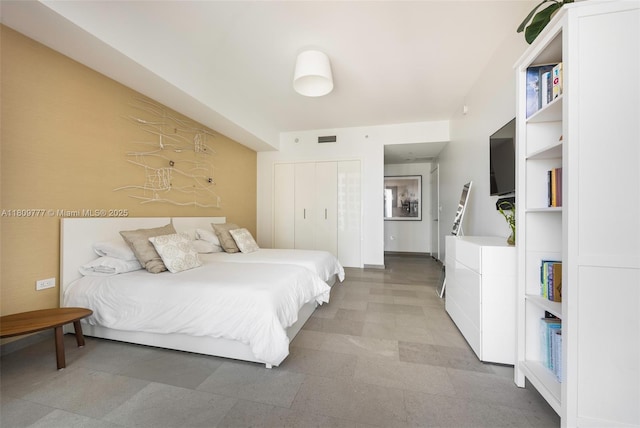 68 SE 6th St Unit 1703, Miami, FL 33131 - bedroom featuring a closet and light flooring