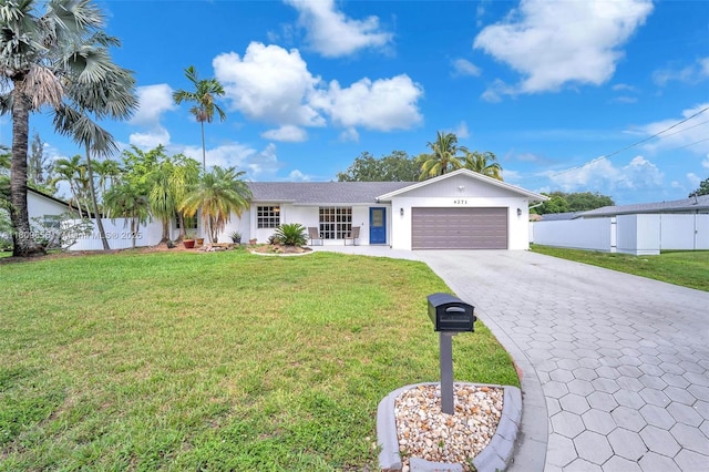 4271 SW 67th Ter, Davie, FL 33314 - single story home with an attached garage, decorative driveway, and stucco siding