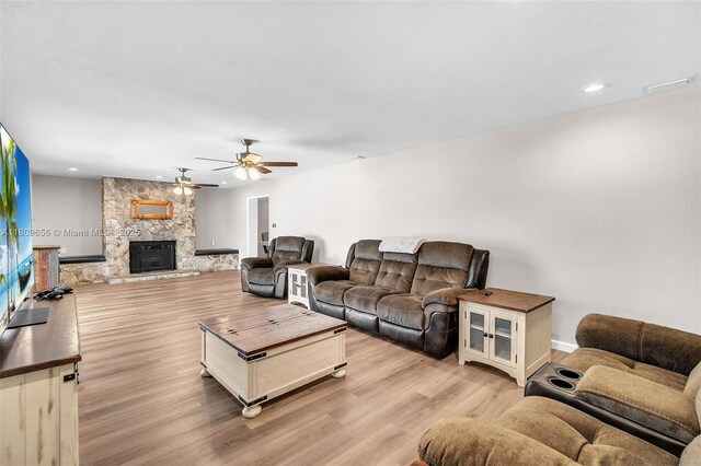 4271 SW 67th Ter, Davie, FL 33314 - living room with a ceiling fan, light wood finished floors, a fireplace, recessed lighting, and baseboards