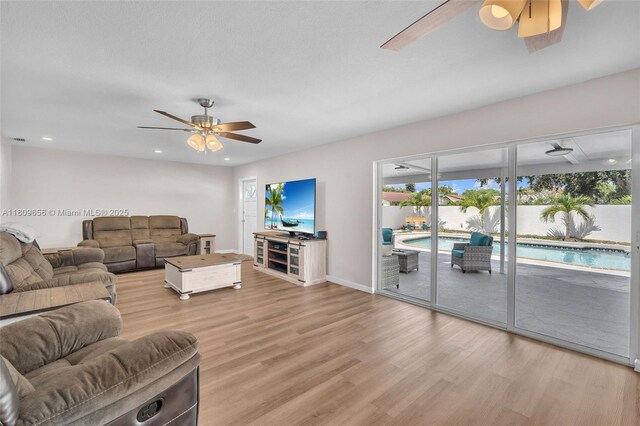 4271 SW 67th Ter, Davie, FL 33314 - living room featuring ceiling fan, light wood-style flooring, recessed lighting, and baseboards