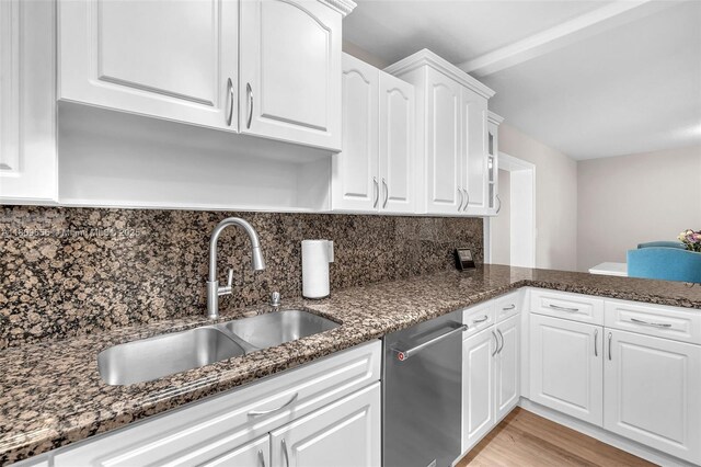 4271 SW 67th Ter, Davie, FL 33314 - kitchen with stainless steel dishwasher, a sink, white cabinets, and dark stone countertops