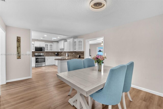 4271 SW 67th Ter, Davie, FL 33314 - dining area featuring light wood-type flooring, baseboards, a ceiling fan, and recessed lighting