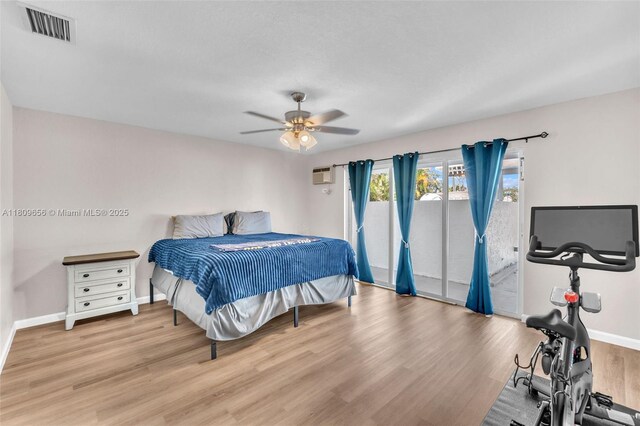 4271 SW 67th Ter, Davie, FL 33314 - bedroom with access to exterior, wood finished floors, baseboards, ceiling fan, and a wall unit AC